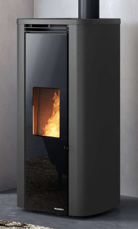 Palazzetti Theo TC 6 US Stufa a Pellet Ermetica Aria Calda Ventilata Canalizzabile Potenza 6 Kw Rivestimento Acciaio Colore Antracite Forma Circolare Uscita Fumi Superiore Doppio Vetro Combustione Totale Pulizia Automatica Braciere Cassetto 52x54 H110 cm