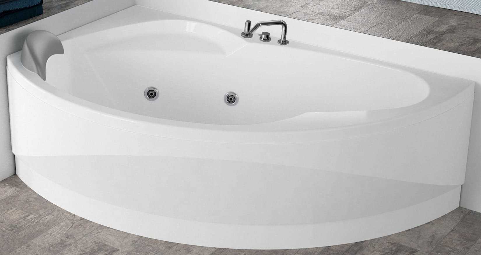 Novellini Vogue Vasca da Bagno Versione Hydro Misura 150x85 H55 cm Idro Whirlpool 5 Jets Forma Esterna Tonda Curva Semicircolare Asimmetrica Interna Ovale Installazione Angolo Sinistra Pannello Colonna Rubinetteria Cuscino Materiale Acrilico Colore Bianco