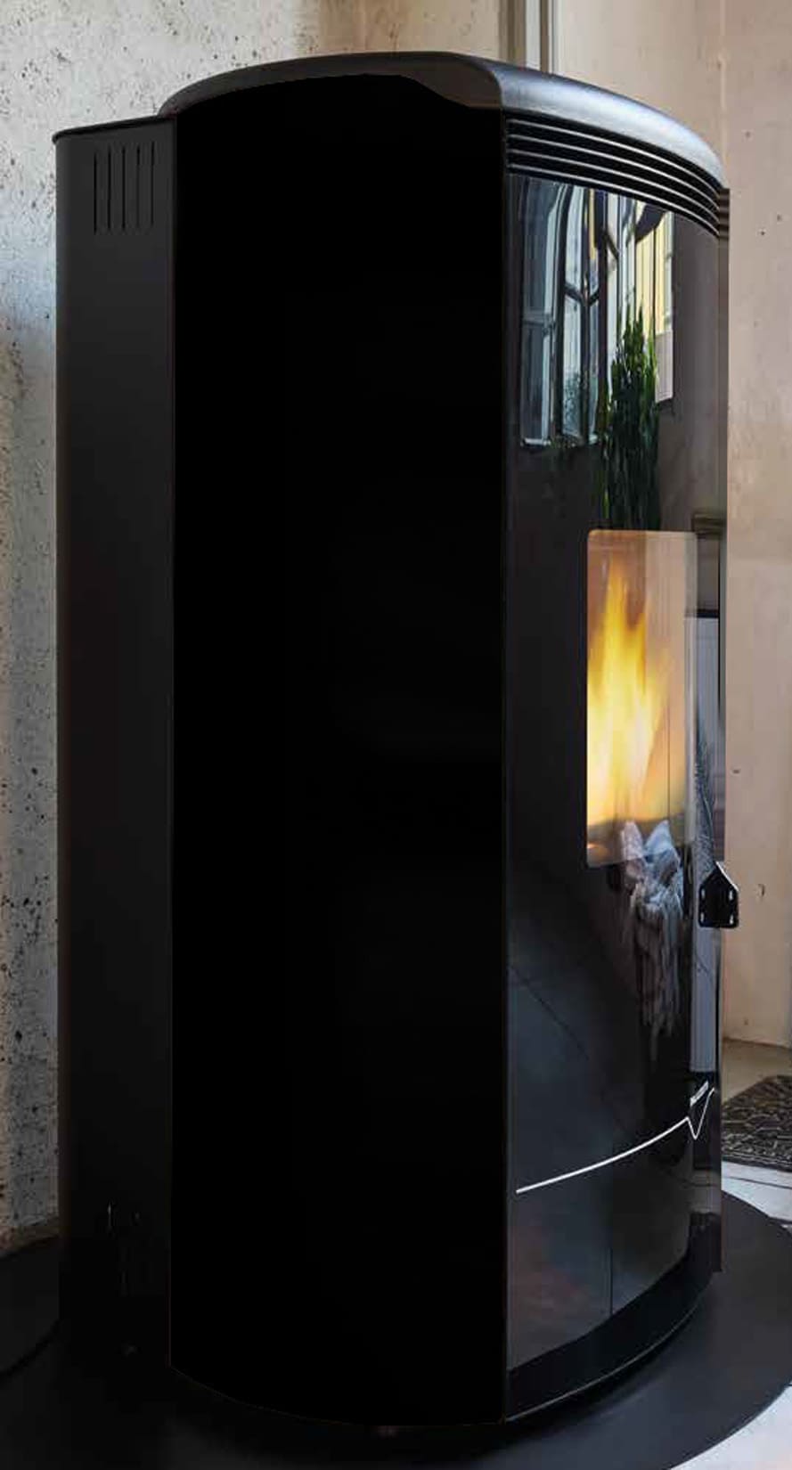 Palazzetti Jackie Idro S26 TC ACS Termo Stufa Pellet Ermetica Aria Ventilata Acqua Calda Sanitaria Potenza 26 Kw Rivestimento Acciaio Nero Top Ghisa Uscita Fumi Posteriore Controllo Sfioro Programma Fasce Orarie Gruppo Idraulico Integrato Autopulizia